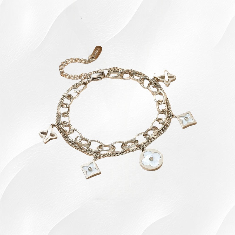 Zilveren schakelarmband met bedels